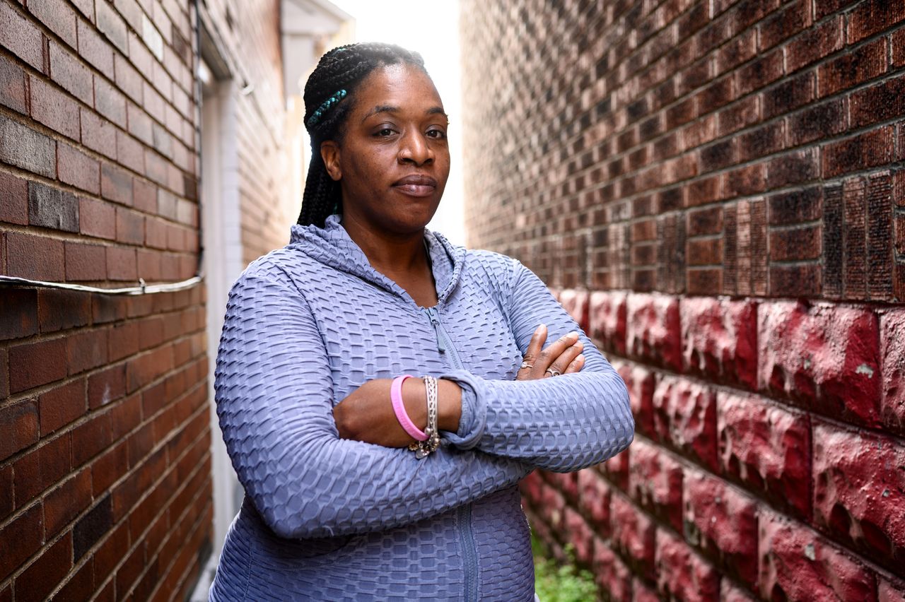 Chartia Worlds, 36, the sister of Christopher Miyares, an unarmed Black man whom John Fetterman pursued after hearing gunfire in 2013, stands near her home in Turtle Creek, Pa., on Oct. 16. She criticizes Fetterman for not apologizing for the mistaken pursuit.