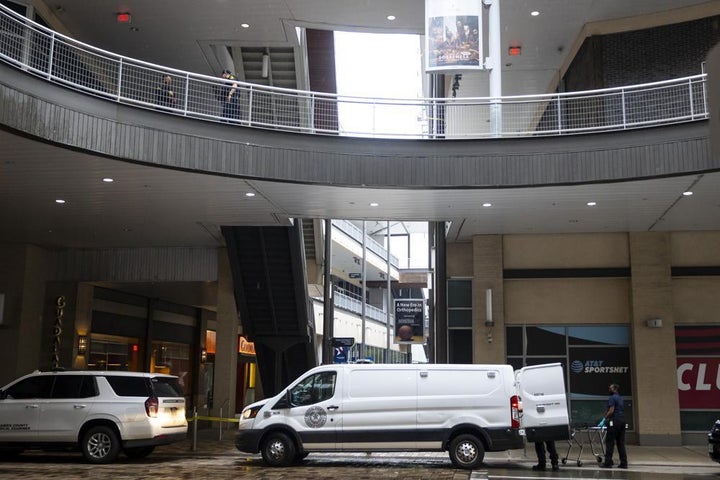 Police and the medical examiner's office work outside 1201 San Jacinto following the shooting on Tuesday, Nov. 1.