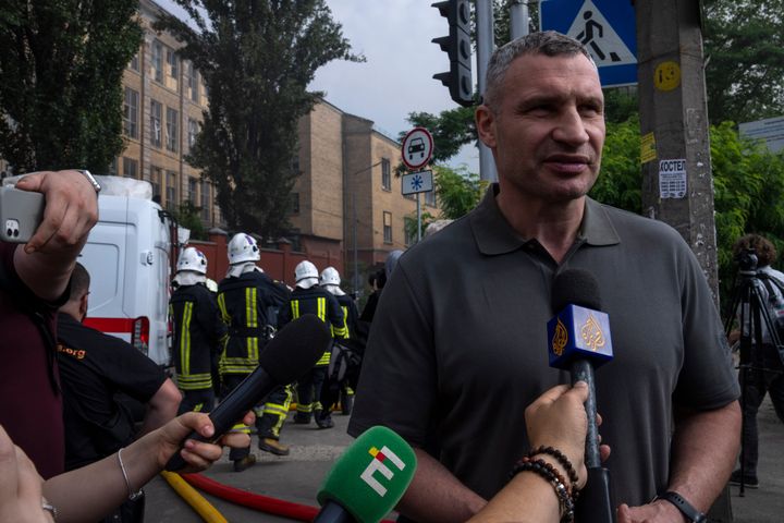 Kyiv mayor Vitali Klitschko speaks to the press at the scene of a residential building following explosions, in Kyiv, Ukraine, on June 26, 2022. "Each day of the war means destroyed villages and cities in Ukraine, and the crippled fates of our colleagues," Klitschko said. 