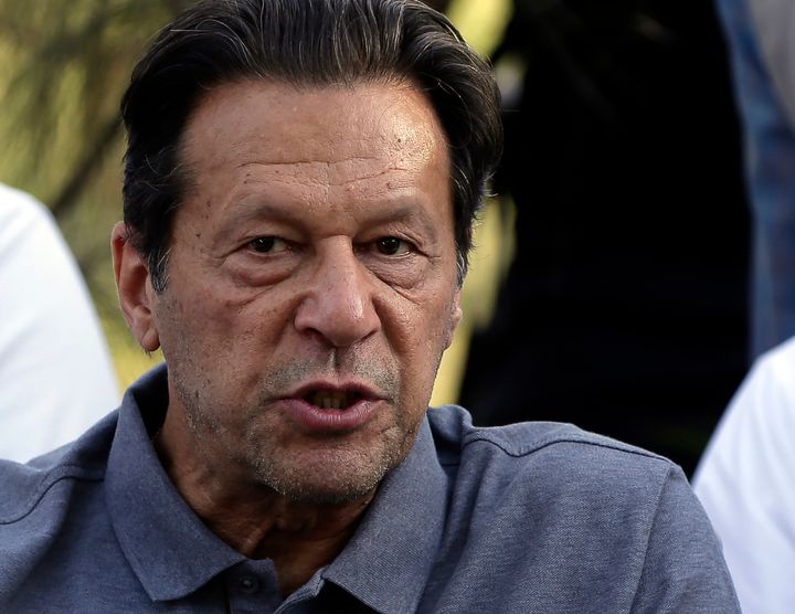 Pakistani officials said a gunman opened fire at a container truck carrying Imran Khan, wounding him slightly and also some of his supporters.