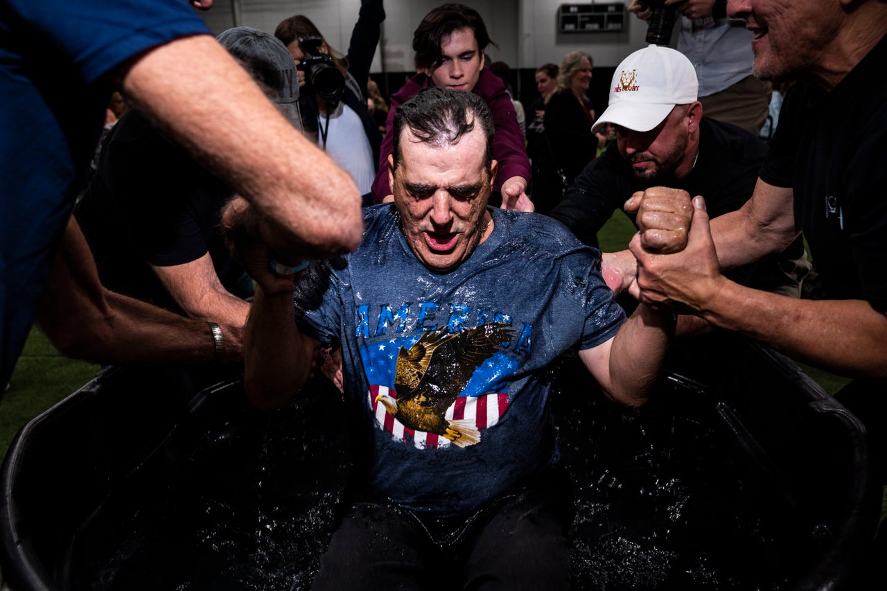 Manheim, PA - October 21 : Attendees are baptized at the Great ReAwakening America Tour held at the Spooky Nook Sports Complex on Friday, Oct 21, 2022 in Manheim, PA.