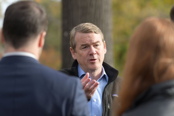 Sen. Michael Bennet answers questions from reporters after he dropped off his ballot at Washington Park in Denver, Colorado, on Wednesday.