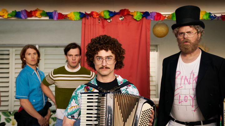 From left: "Weird Al" band members Steve Jay (Spencer Treat Clark) and Bermuda (Tommy O'Brien) with "Weird Al" (Radcliffe) and deejay Dr. Demento (Rainn Wilson) in "Weird: The Al Yankovic Story."
