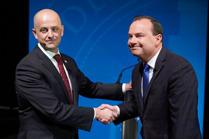Utah Republican Sen. Mike Lee (right) and his independent challenger Evan McMullin shake hands before their televised debate, on Oct. 17, 2022, in Orem, Utah. Tech companies and Democratic Party-aligned groups are among those funneling millions into Utah to support McMullin's bid to unseat Lee.