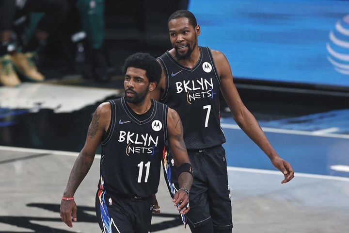 Nets guard Irving (11) and Durant react against the Boston Celtics in the second half of Game 5 during the NBA's first-round playoff series on June 1, 2021, in New York.