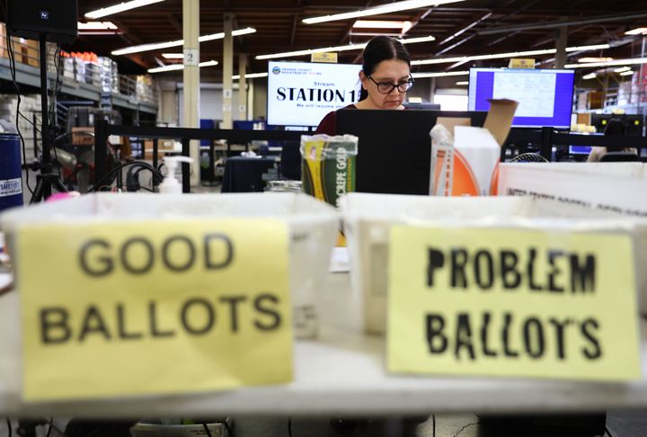 As election workers process mail ballots, they need to verify signatures and identify any other errors made by the voter. This process takes time.