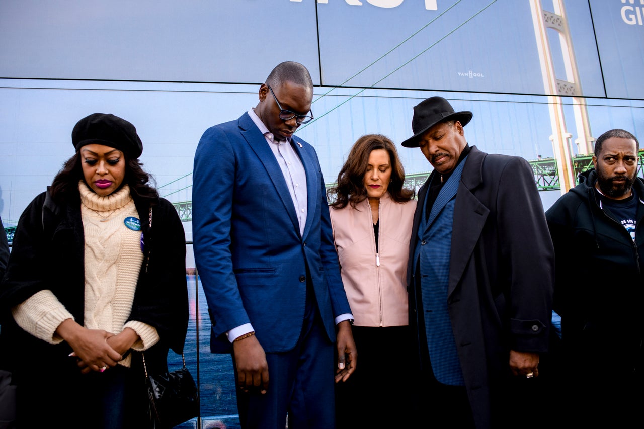 Whitmer prays alongside Gilchrist, left, and Rev. Dr. Curtis C. Williams, right, at the conclusion of a campaign kickoff event in Detroit on Oct. 21.