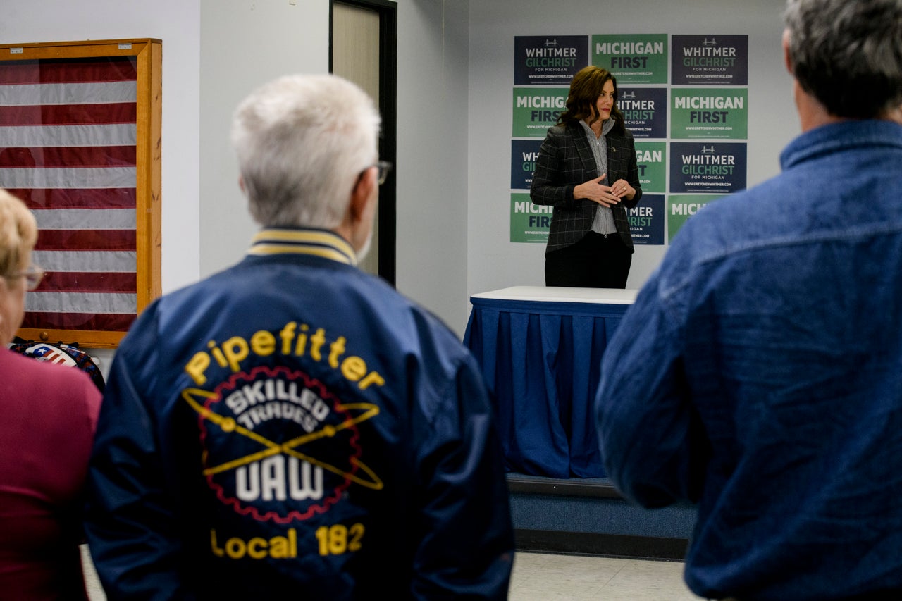 Whitmer looks on as Rep. Debbie Dingell (D-Mich.) speaks to attendees during a campaign event at the UAW Local 3000 offices on Oct. 26.