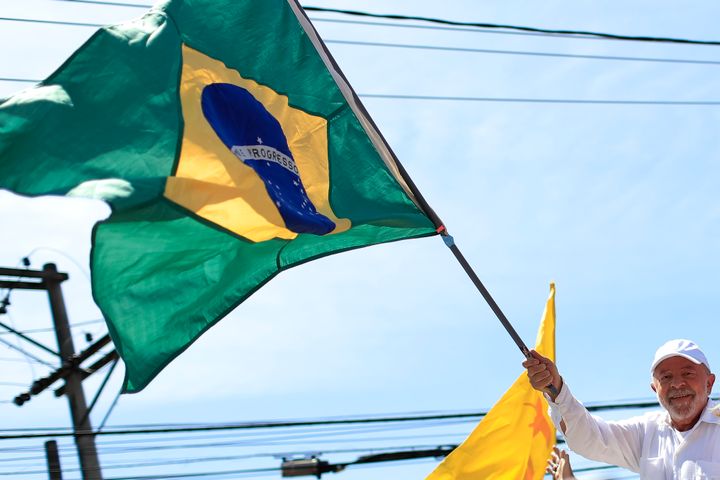 Brazil's president-elect, Luiz Inácio Lula da Silva, waves a Brazilian flag during a rally on Oct. 20, 2022, in São Gonçalo, Brazil.