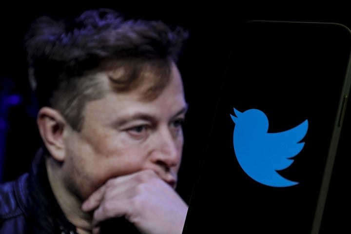 In this photo illustration, the image of Elon Musk is displayed on a computer screen and the logo of twitter on a mobile phone in Ankara, Turkey on October 6, 2022.