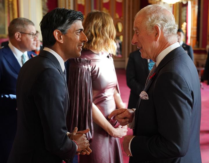 King Charles III speaks with Rishi Sunak during a reception at Buckingham Palace ahead of the Cop27 summit. 