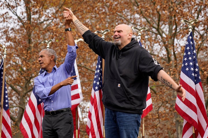 Former President Barrack Obama, left, finishes his remarks and welcomes Pennsylvania Lt. Gov. John Fetterman, a Democratic candidate for U.S. Senate, to the stage during a campaign rally in Pittsburgh, Saturday, Nov. 5, 2022. (AP Photo/Gene J. Puskar)