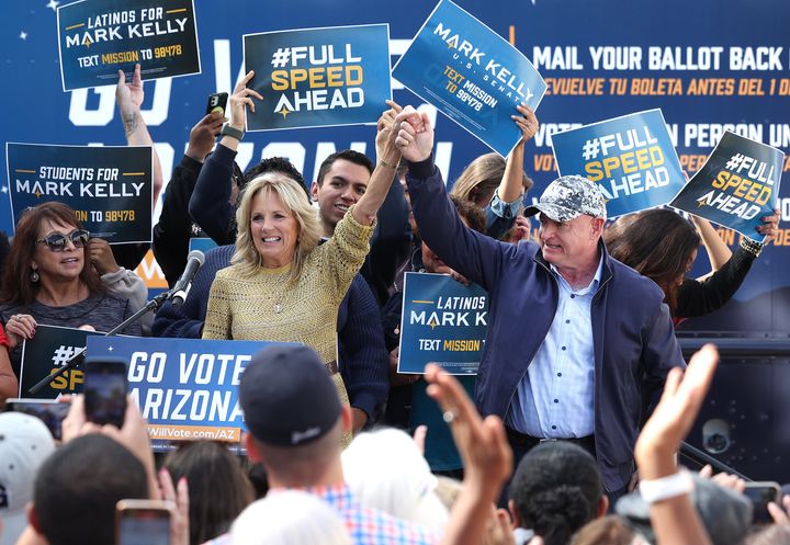 First Lady Jill Biden cheers with Democratic senate candidate U.S. Sen. Mark Kelly (D-AZ) during a campaign event on November 05, 2022 in Tucson, Arizona. Kelly is in a tight race against Republican Senate candidate Blake Masters. 