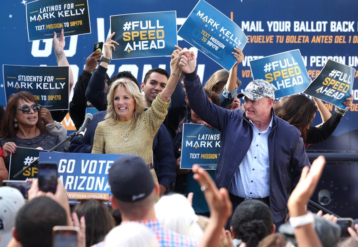 First Lady Jill Biden cheers with Democratic senate candidate U.S. Sen. Mark Kelly (D-AZ) during a campaign event on November 05, 2022 in Tucson, Arizona. Kelly is in a tight race against Republican Senate candidate Blake Masters.