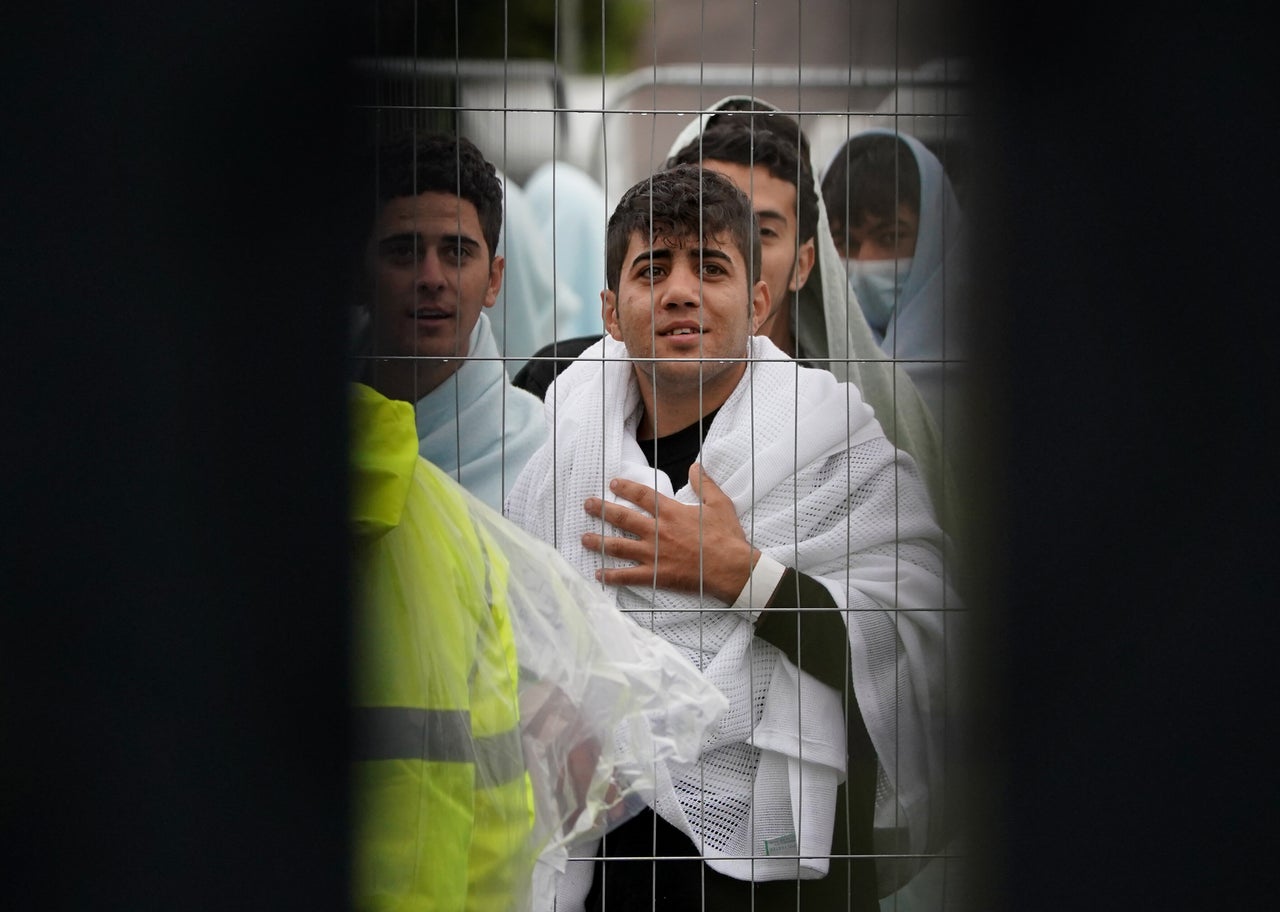 People pictured at the Manston processing centre in Kent.