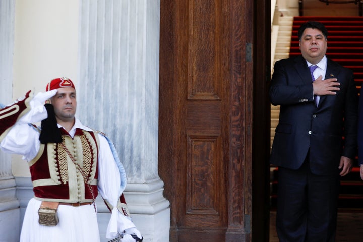 Newly appointed U.S. Ambassador to Greece George Tsounis listens to the U.S. national anthem after a credentials presentation ceremony at the Presidential Palace in Athens, Greece, May 10, 2022. REUTERS/Costas Baltas