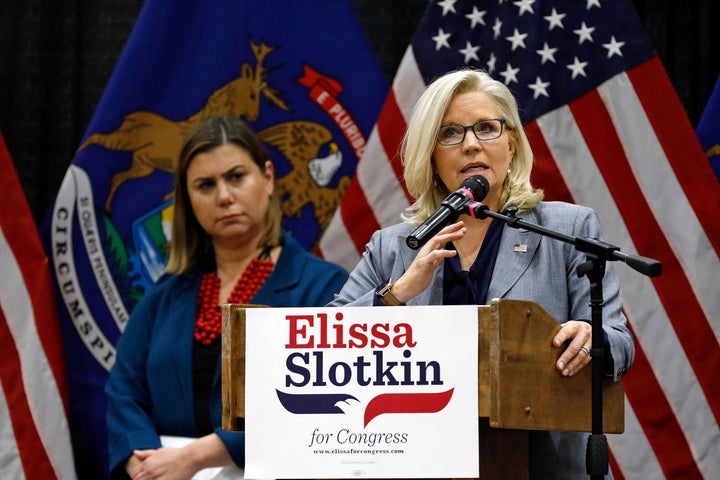 At a Nov. 1 campaign event in East Lansing, Michigan, Democratic Rep. Elissa Slotkin of Michigan (left) looks on as GOP Rep. Liz Cheney of Wyoming makes a plea for supporting candidates like Slotkin who are committed to democracy and recognizing election results.