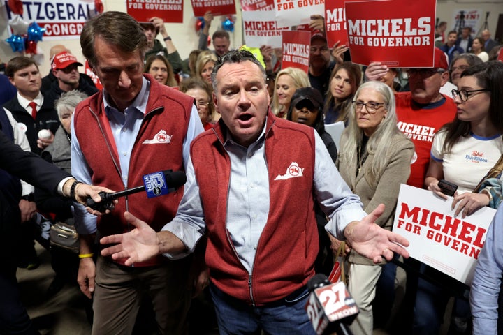 Wisconsin Republican gubernatorial candidate Tim Michels, right, campaigns with Virginia Gov. Glenn Youngkin, left, on Oct. 26 in Waukesha, Wisconsin.