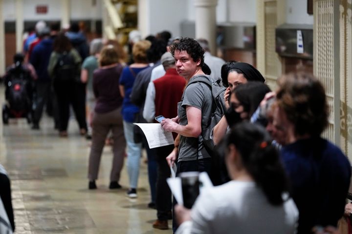 Voters wait in line to make corrections to their ballots for the midterm elections at City Hall in Philadelphia, on Nov. 7, 2022. 