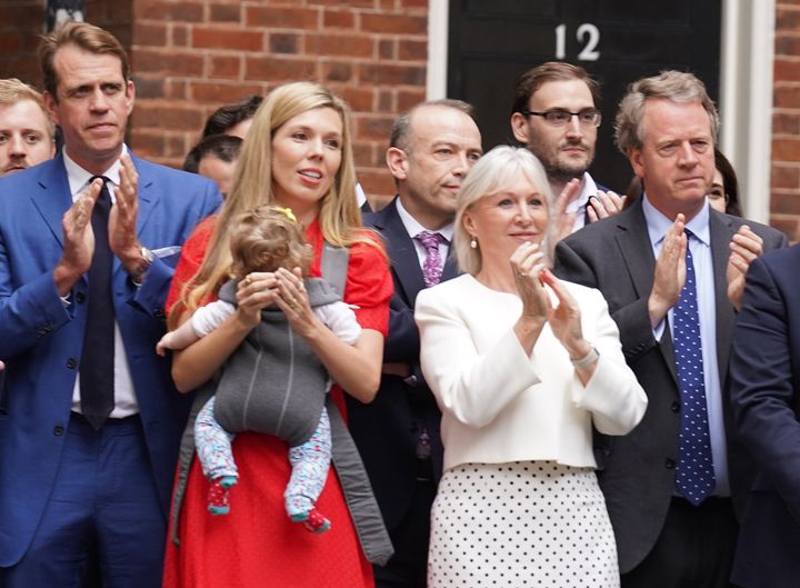 Nadine Dorries and Alister Jack (front row, far right), pictured with Boris Johnson's wife Carrie, are both in line for peerages.