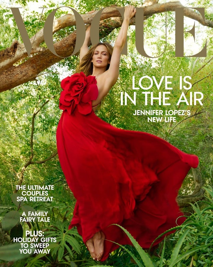 Lopez wears a Valentino Haute Couture dress on the cover of Vogue December 2022. 