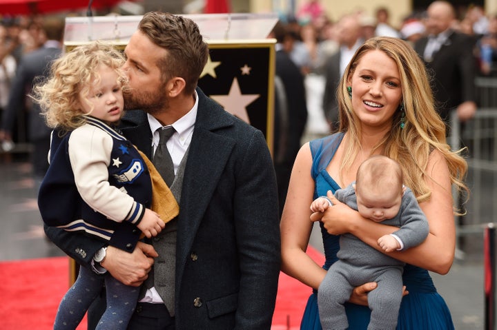 Ryan Reynolds and Blake Lively pose with their daughters, James and Inez, as Reynolds was honored with his star on the Hollywood Walk of Fame in 2016.