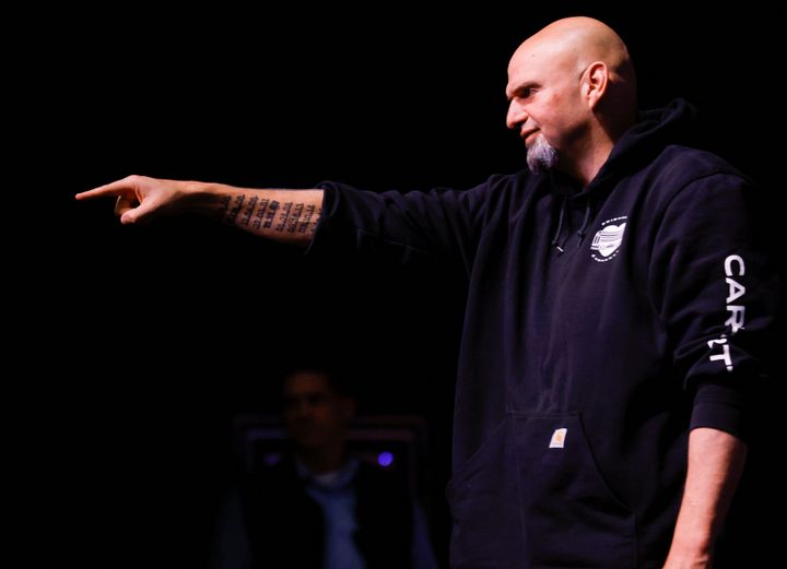 John Fetterman points at his crowd of supporters after he was projected to win the key Pennsylvania Senate race.