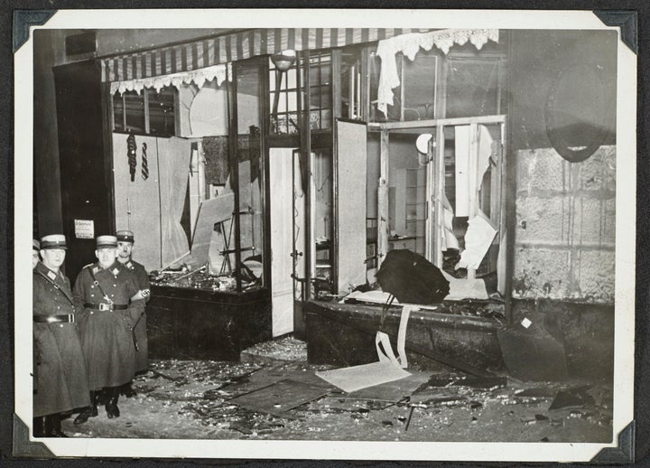 Firefighters, SS special police officers and members of the general public are all seen in the photos participating in the Kristallnacht.