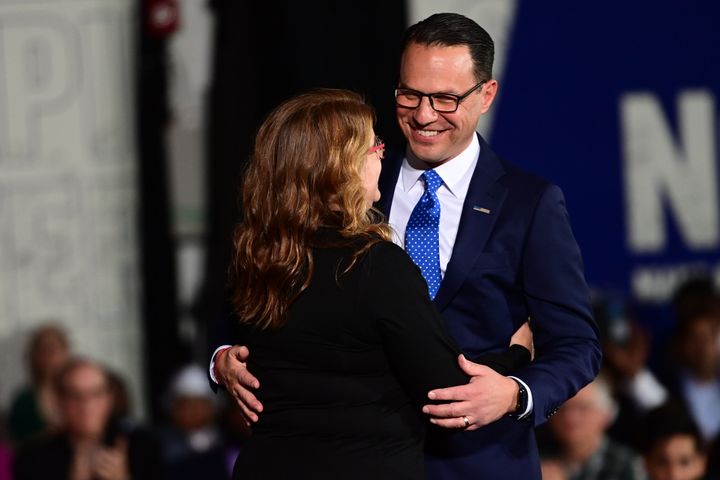 Democratic gubernatorial nominee Josh Shapiro embraces his wife, Lori Shapiro, onstage after giving a victory speech to supporters at the Greater Philadelphia Expo Center on Nov. 8 in Oaks, Pennsylvania.
