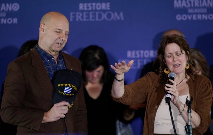 Pennsylvania Republican gubernatorial candidate Doug Mastriano and his wife Rebecca Mastriano pray on stage during his election night campaign gathering at the Penn Harris Hotel in Camp Hill, Pa., Tuesday, Nov. 8, 2022. Democrat Josh Shapiro won the race for governor of Pennsylvania.