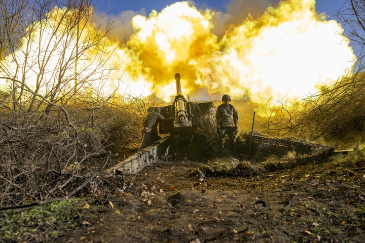 A Ukrainian soldier of an artillery unit fires towards Russian positions outside Bakhmut on November 8, 2022.