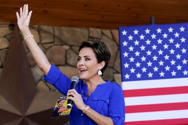 Republican gubernatorial candidate Kari Lake waves to supporters at a campaign event in Queen Creek, Ariz., Wednesday, Oct. 5, 2022. (AP Photo/Ross D. Franklin)
