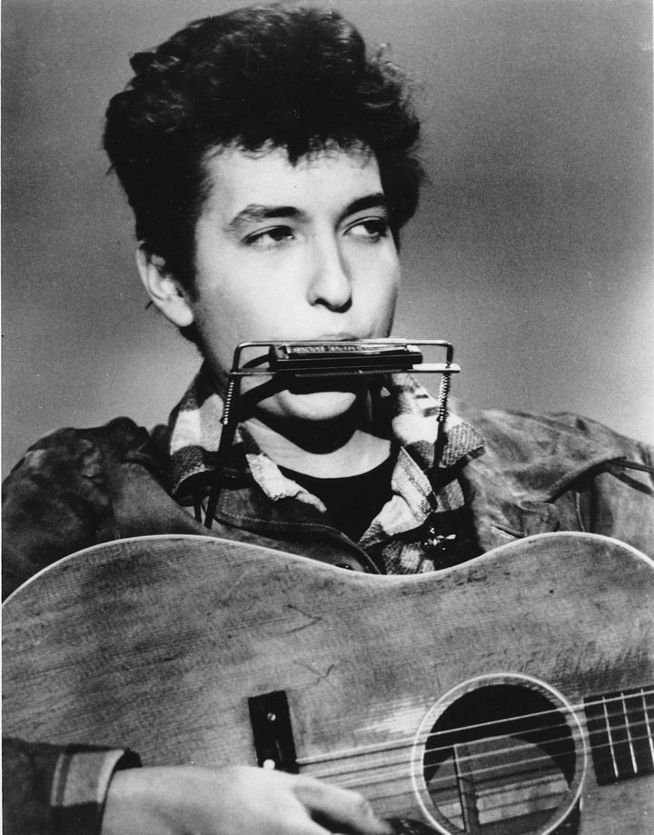 Folk singer and songwriter Bob Dylan plays the harmonica and acoustic guitar in March 1963 at an unknown location. He was born in Duluth, Minnesota in 1941 as Robert Allen Zimmerman. (AP Photo)