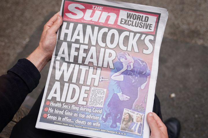 The Sun newspaper with the story and pictures of Matt Hancock appearing to kiss his adviser Gina Coladangelo.