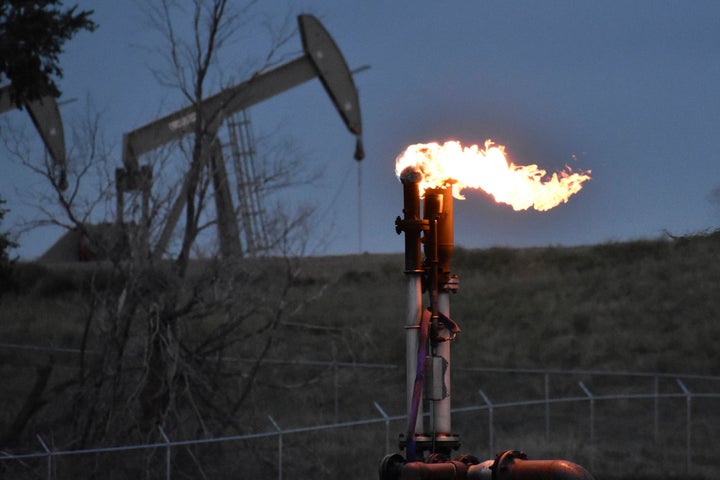 A flare to burn methane from oil production is seen on a well pad near Watford City, North Dakota, Aug. 26, 2021. The Biden administration is ramping up efforts to reduce methane emissions, targeting the oil and gas industry for its role in global warming even as President Joe Biden has pressed energy producers for more oil drilling to lower prices at the gasoline pump. 