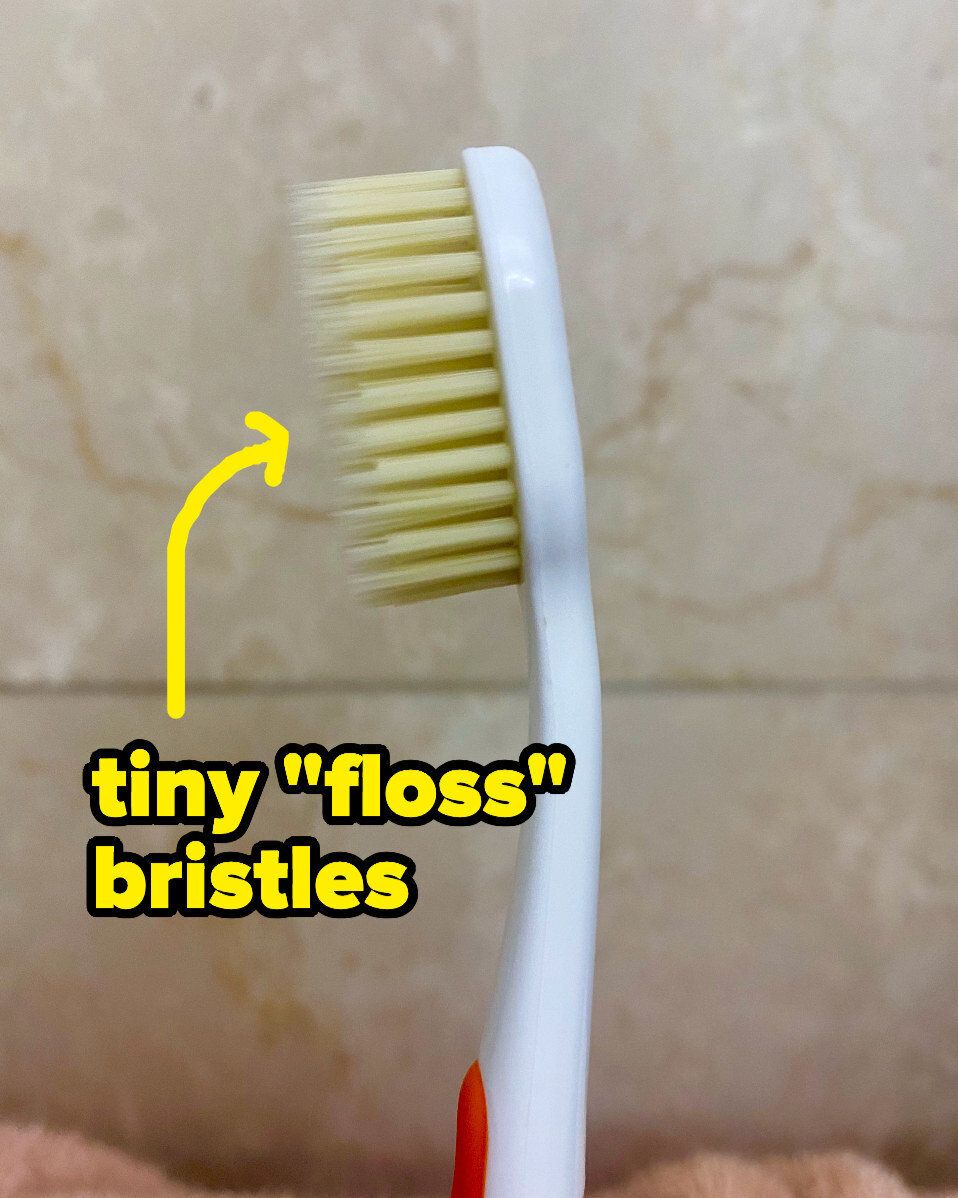 A "flossing toothbrush" with two layers of bristles — regular firm bristles and longer ones