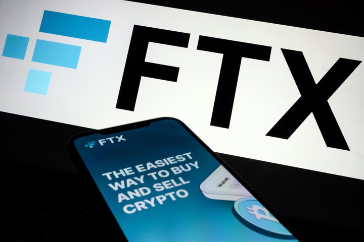 In this photo illustration, the FTX logo and mobile app are displayed on screens on November 10, 2022 in London, England. (Photo Illustration by Leon Neal/Getty Images)