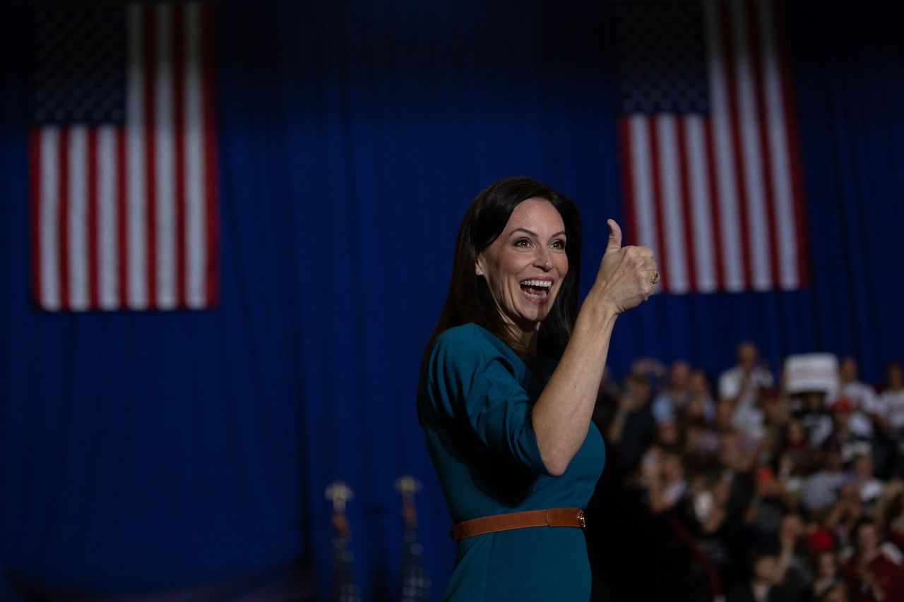 Republican gubernatorial candidate Tudor Dixon gives a thumbs up during a "Save America" rally on Oct. 1 in Warren, Michigan. Trump endorsed Dixon, secretary of state nominee Kristina Karamo and attorney general candidate Matthew DePerno, who all lost their races. He also endorsed Republican House candidate John James, who narrowly won.