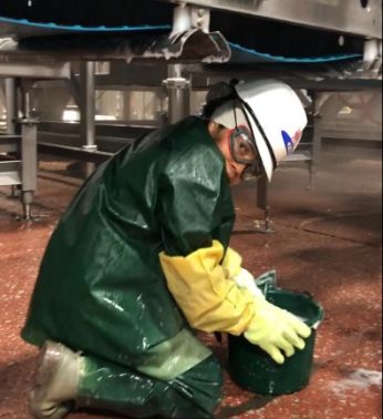 A photo from the Labor Department's court filing shows a PSSI employee working in a meatpacking plant.