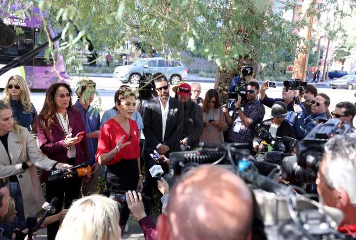 PHOENIX, ARIZONA - NOVEMBER 08: Arizona Republican gubernatorial candidate Kari Lake (C) speaks to reporters after casting her ballot on November 08, 2022 in Phoenix, Arizona. Lake is running in a tight race against Democratic challenger Katie Hobbs. (Photo by Justin Sullivan/Getty Images)