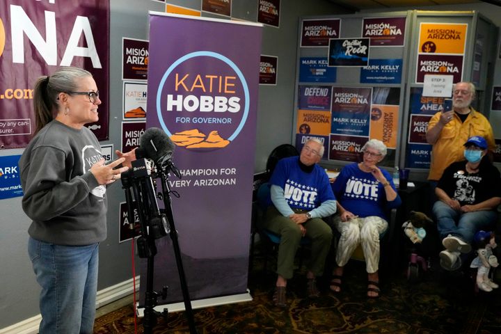 Katie Hobbs, left, Arizona Democratic candidate for governor, talks to supporters at a campaign event in Peoria, Ariz., Monday, Nov. 7, 2022. (AP Photo/Ross D. Franklin)