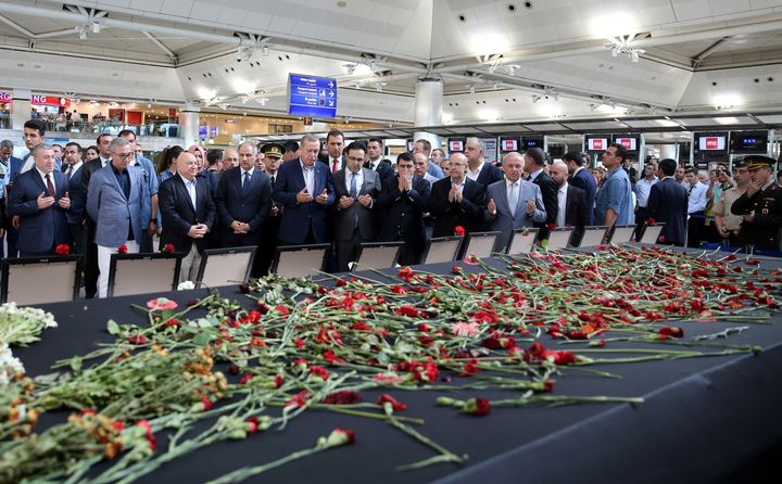 ISTANBUL, TURKEY - JULY 02 : Turkish President Recep Tayyip Erdogan (5th L) attends a commemorative ceremony held for the victims of the Istanbul Ataturk Airport terror attack at the International departure terminal in Istanbul, Turkey on July 02, 2016. (Photo by Turkish Presidency / Murat Cetinmuhurdar/Anadolu Agency/Getty Images)
