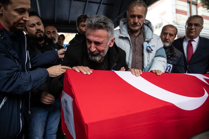 Nurettin Ucar, father of Yagmur Ucar, a 15-year-old victim of Sunday's blast that took place on Istanbul's famous Istiklal Street, grieves during a funeral ceremony of his wife and daughter on November 14, 2022 in Istanbul, Turkey. Turkish officials have said a woman was arrested in connection with yesterday's bombing. They alleged she was seen sitting on a bench for 40 minutes and leaving just before the blast.