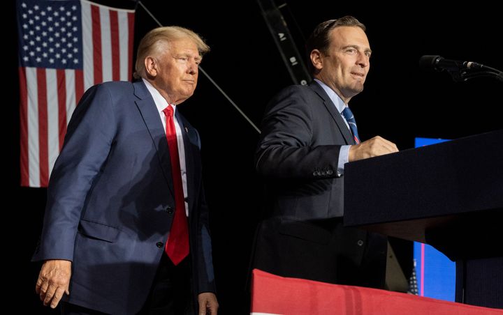 Adam Laxalt, the Republican candidate for a U.S. Senate seat in Nevada, appears with former President Donald Trump at an Oct. 8 rally in Minden, Nevada. Laxalt lost to Democratic incumbent Catherine Cortez Masto by less than 1 percentage point.