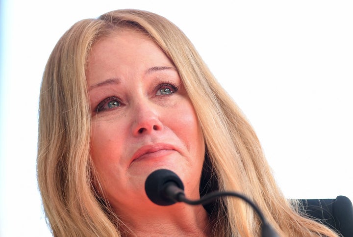 Christina Applegate cries while thanking her 11-year-old daughter Sadie at her Hollywood Walk of Fame ceremony on Monday.