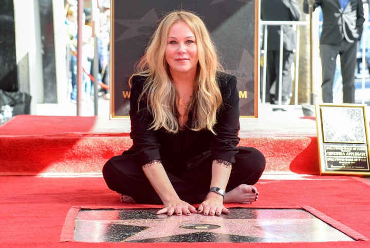 Applegate poses with her Walk of Fame star on Monday.