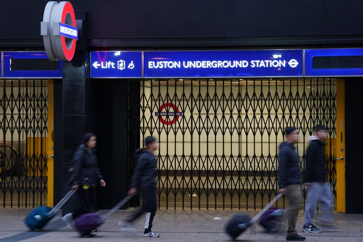 People walk past the closed shutters at the entrance to Euston underground station in central London, during a RMT strike last week.
