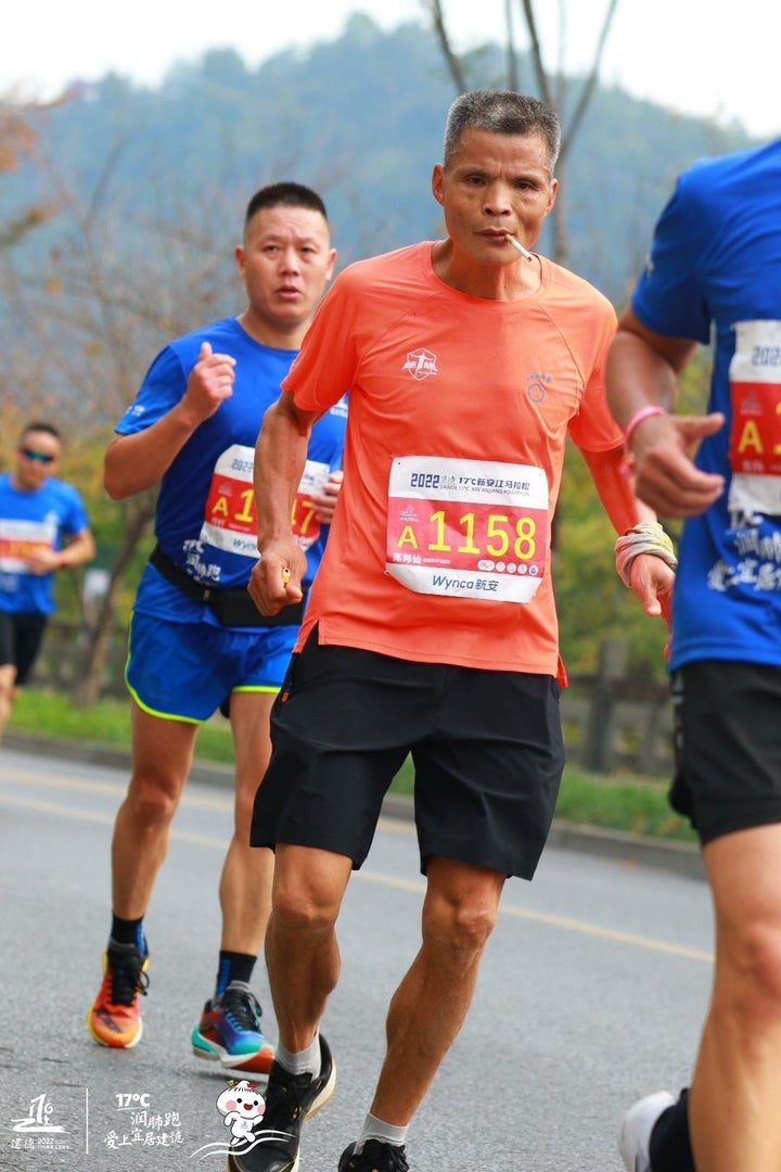 In one of the viral photos, "Uncle Chen" is seen running in the Xin’anjiang Marathon on Nov. 6.