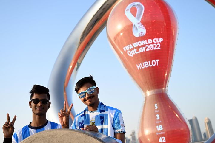15 November 2022, Qatar, Doha: Argentine soccer fans from Bangladesh show the Victory sign. The opening match between Qatar and Ecuador will kick off the 2022 World Cup on Nov. 20. Photo: Federico Gambarini/dpa (Photo by Federico Gambarini/picture alliance via Getty Images)