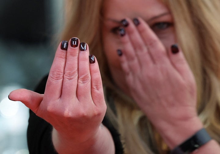 Applegate shows off her fucking amazing manicure.